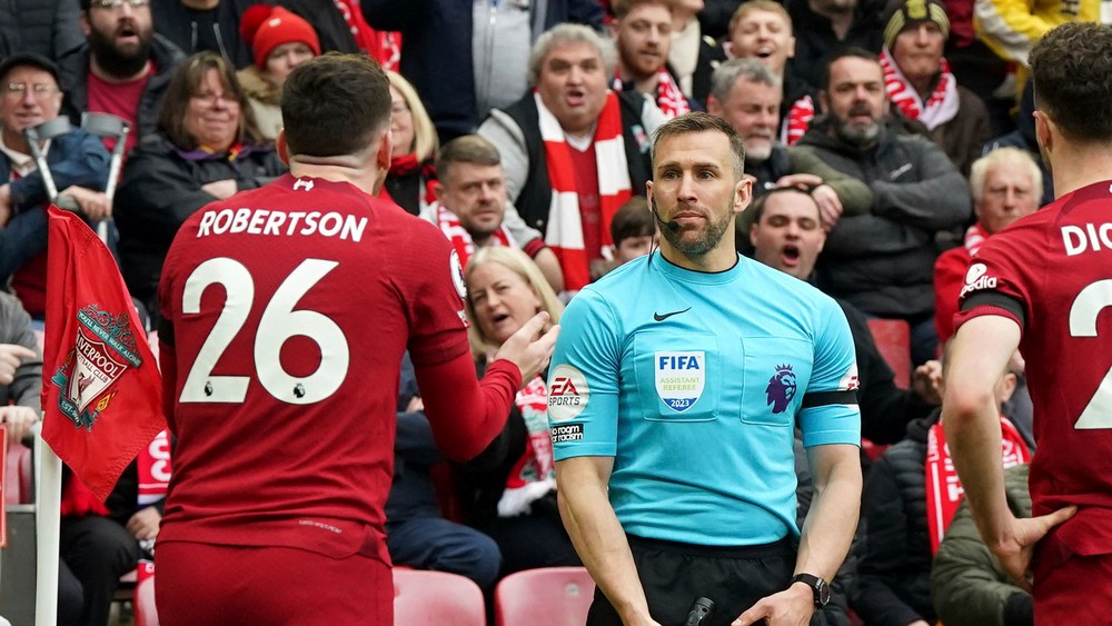 “Linesman’s Future in Doubt: Investigation into Elbow Incident with Liverpool Defender”