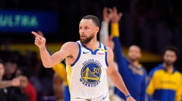 Golden State Warriors guard Stephen Curry left, gestures after scoring during the second half of an NBA basketball game against the Los Angeles Lakers, Thursday, April 3, 2025, in Los Angeles. (AP Photo/Mark J. Terrill)