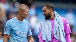 Erling Haaland a Gianluigi Donnarumma.