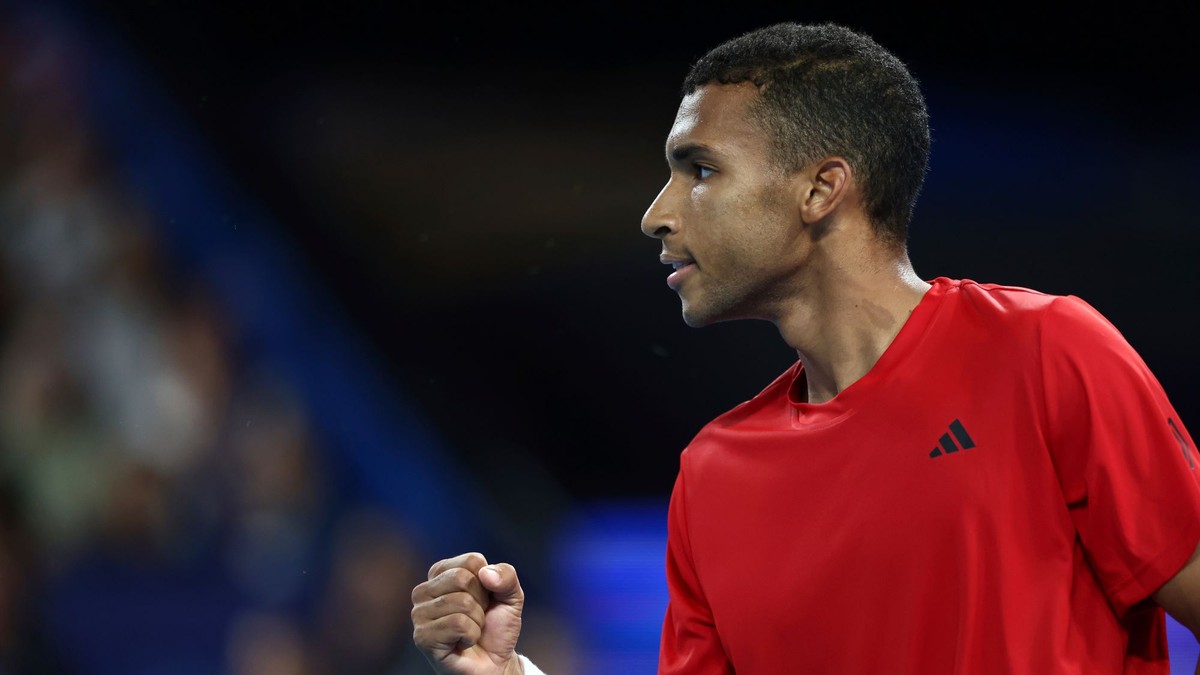 Felix Auger-Aliassime of Canada celebrates winning a crucial point from Taylor Fritz of the United States during their United Cup tennis match in Perth, Australia, Sunday, Dec. 29, 2024. (AP Photo/Trevor Collens)