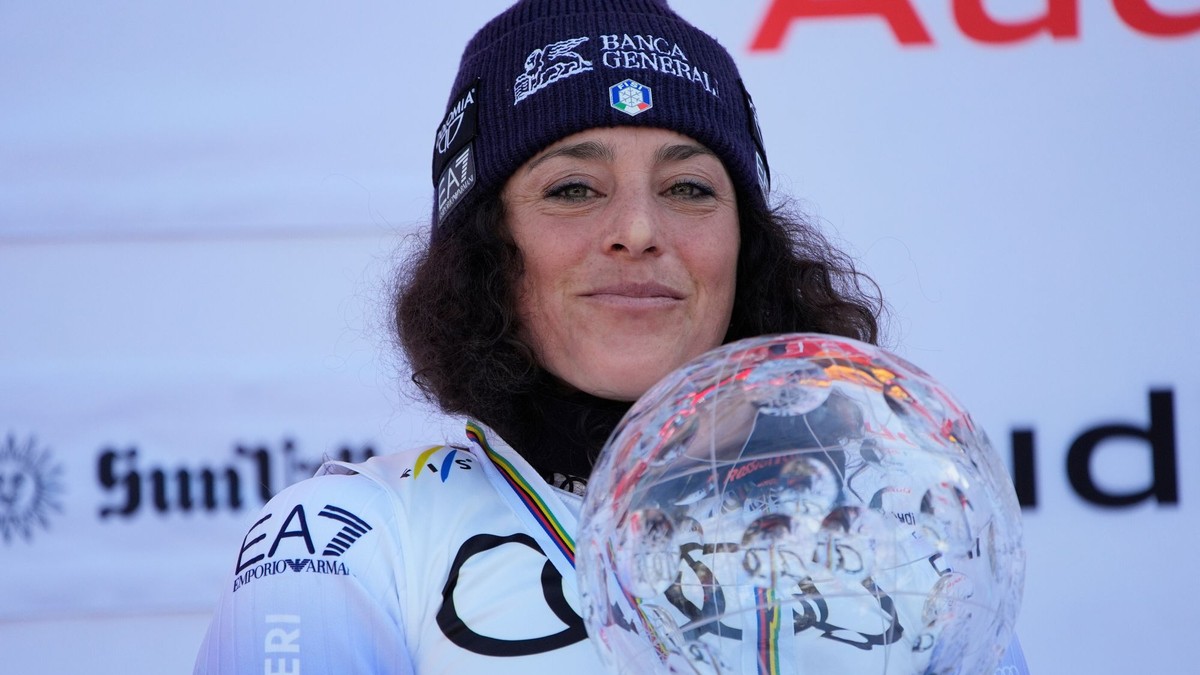 FILE - Italy's Federica Brignone smiles on the podium after winning the women's World Cup overall at the World Cup Finals, March 27, 2025, in Sun Valley, Idaho. (AP Photo/John Locher, File)