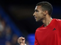 Felix Auger-Aliassime of Canada celebrates winning a crucial point from Taylor Fritz of the United States during their United Cup tennis match in Perth, Australia, Sunday, Dec. 29, 2024. (AP Photo/Trevor Collens)