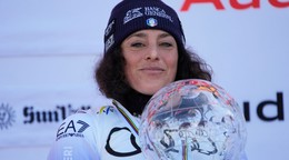 FILE - Italy's Federica Brignone smiles on the podium after winning the women's World Cup overall at the World Cup Finals, March 27, 2025, in Sun Valley, Idaho. (AP Photo/John Locher, File)