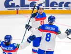 Na snímke hokejisti Slovenska sa tešia zo štvrtého gólu, vpravo strelec gólu Oliver Okuliar počas zápasu.