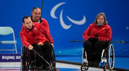 Slovenskí reprezentanti v curlingu na vozíku.