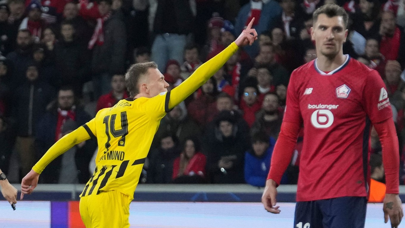 Dortmund's Maximilian Beier celebrates after scoring during the Champions League round of 16 second leg soccer match between Lille and Borussia Dortmund in Villeneuve-d'Ascq , Wednesday, March 12, 2025. (AP Photo/Michel Euler)