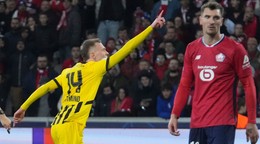 Dortmund's Maximilian Beier celebrates after scoring during the Champions League round of 16 second leg soccer match between Lille and Borussia Dortmund in Villeneuve-d'Ascq , Wednesday, March 12, 2025. (AP Photo/Michel Euler)