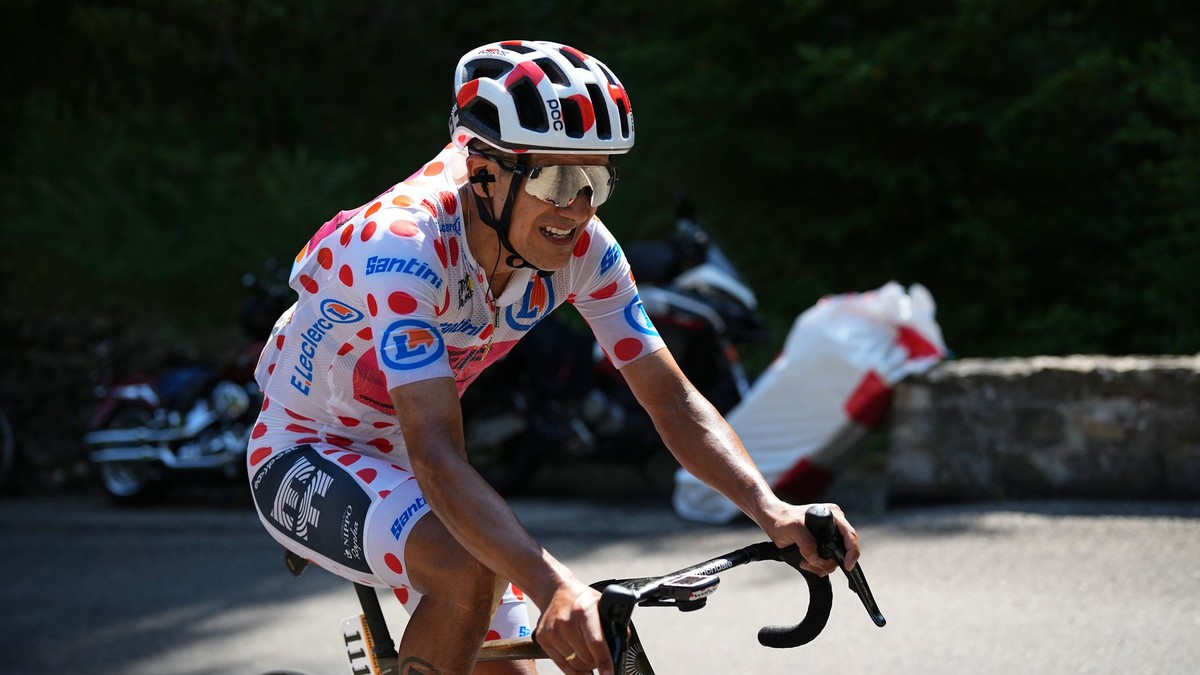 Ecuador's Richard Carapaz, wearing the best climber's dotted jersey, rides during the twentieth stage of the Tour de France cycling race over 132.8 kilometers (82.5 miles) with start in Nice and finish in La Couillole pass, France, Saturday, July 20, 2024. (AP Photo/Daniel Cole)