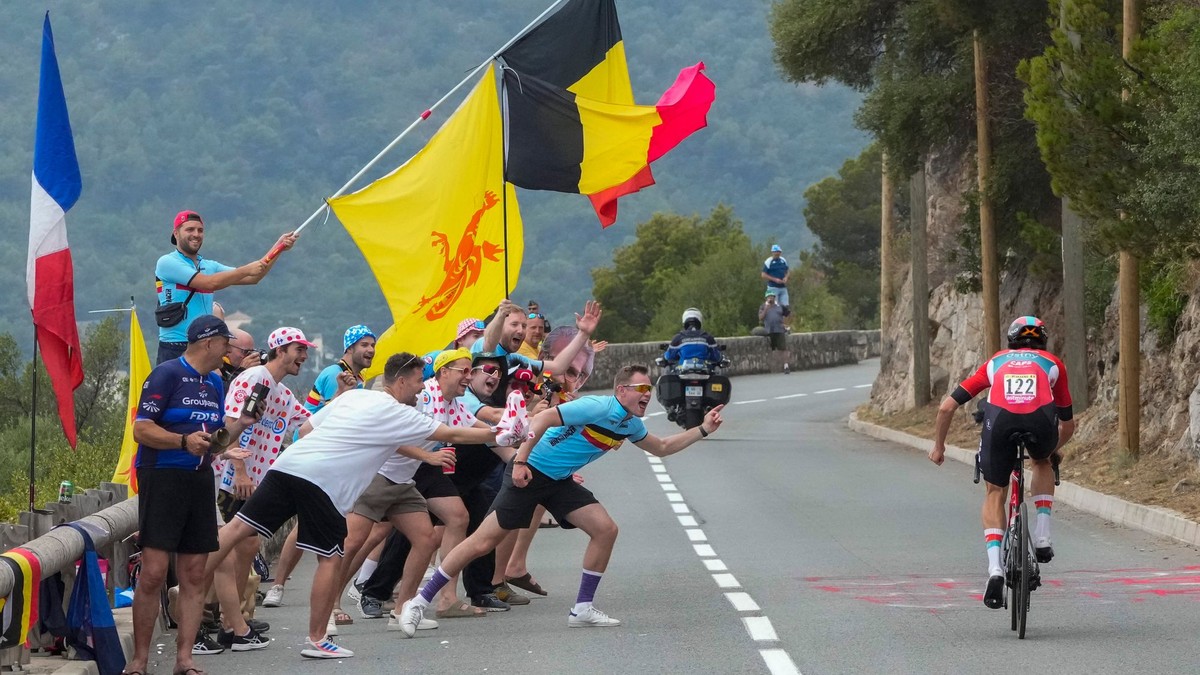 Belgium's Cedric Beulens is cheered on by Belgium fans during the twenty-first stage of the Tour de France cycling race, an individual time trial over 33.7 kilometers (20.9 miles) with start in Monaco and finish in Nice, France, Sunday, July 21, 2024. (AP Photo/Jerome Delay)