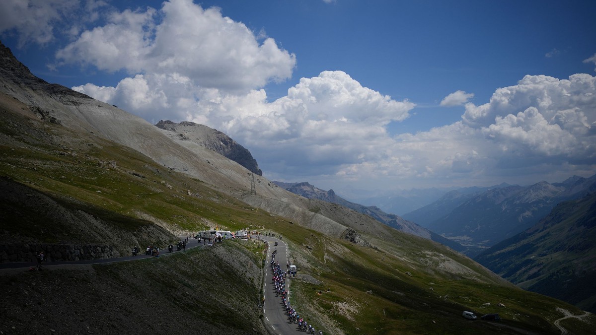 FILE - The pack climbs Col du Galibier pass during the twelfth stage of the Tour de France cycling race over 165.5 kilometers (102.8 miles) with start in Briancon and finish in Alpe d'Huez, France, Thursday, July 14, 2022. (AP Photo/Daniel Cole, File)