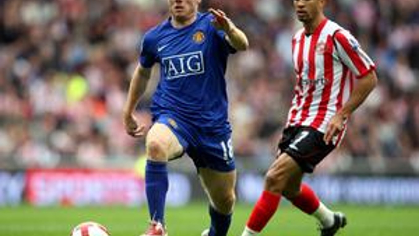 Paul Scholes (vľavo) sa chystá zavesiť kopačky na klinec.