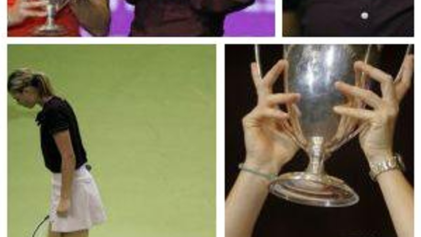 Justine Heninová drží nad hlavou trofej za víťazstvo na MS WTA Tour v španielskom Madride