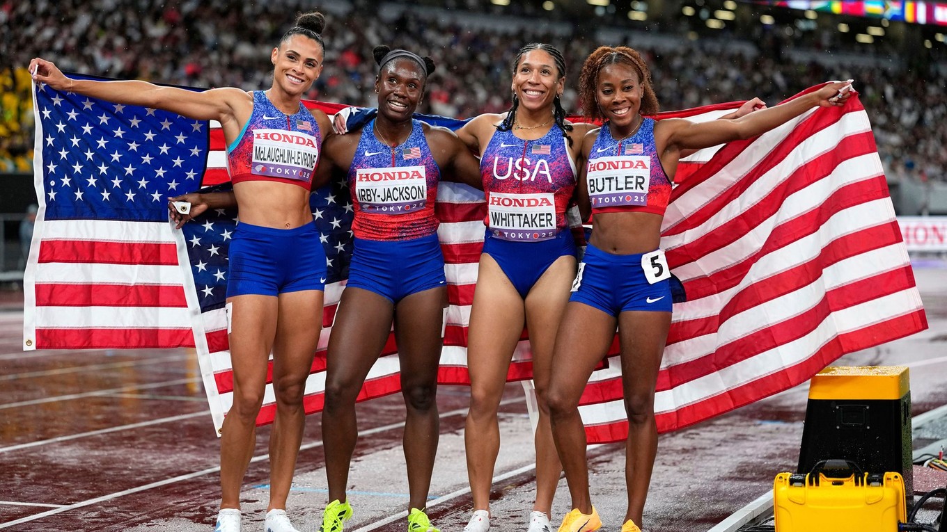 Team United States pose after winning the gold medal in the women's 4 X 400 meters relay at the World Athletics Championships in Tokyo, Sunday, Sept. 21, 2025. (AP Photo/Matthias Schrader)