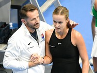 Anna Karolína Schmiedlová a nehrajúci kapitán slovenského tímu Matej Lipták.
