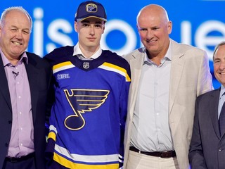 Adam Jiricek, second from left, poses after being se3lected by the St. Louis Blues during the first round round of the NHL hockey draft Friday, June 28, 2024, in Las Vegas. (AP Photo/Steve Marcus)