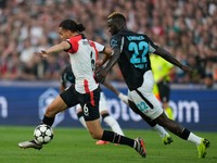 Feyenoord's Ramiz Zerrouki, left, and Leverkusen's Victor Boniface fight for the ball during the Champions League opening phase soccer match between Feyenoord and Leverkusen in Rotterdam, Netherlands, Thursday, Sept. 19, 2024. (AP Photo/Peter Dejong)

- XCHAMPIONSLEAGUEX