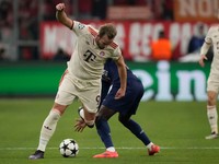 Bayern's Harry Kane, front, duels for the ball with PSG's Nuno Mendes during the Champions League opening phase soccer match between FC Bayern and Paris Saint Germain, at the Allianz Arena in Munich, Germany, Tuesday, Nov. 26, 2024.(AP Photo/Matthias Schrader)

- XCHAMPIONSLEAGUEX