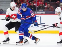 USA forward Max Plante (22) moves the puck forward with his skate as Switzerland defenseman Eric Schneller (26) and forward Rico Gredig (8) defend during the first period of a quarterfinal match at the IIHF World Junior Hockey Championship in Ottawa, Ontario Thursday, Jan. 2, 2025. (Sean Kilpatrick/The Canadian Press via AP)

- Ottawa;Ontario;Canada;Cppixottawa;Hockey;Tournaments;World Juniors;Ottawa25;Ottawa2025;athlete;athletes;athletic;athletics;Canadian;competative;compete;competing;competition;competitions;competitive;farm;game;games;Jr;junior;juniors;League;minor;minors;play;player;playing;pro;professional;sport;sporting;sports;team;tournament;World;Canadian Tire Centre