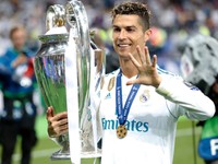 FILE - Real Madrid's Cristiano Ronaldo celebrates with the trophy after winning the Champions League Final soccer match between Real Madrid and Liverpool at the Olimpiyskiy Stadium in Kiev, Ukraine, Saturday, May 26, 2018. (AP Photo/Pavel Golovkin, File)