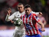 Atletico Madrid's Clement Leng, front, left, and Real Madrid's Kylian Mbappe fight for the ball during the Champions League round of 16, second leg, soccer match between Atletico Madrid and Real Madrid at the Metropolitano stadium in Madrid, Spain, Wednesday, March 12, 2025. (AP Photo/Bernat Armangue)

- XCHAMPIONSLEAGUEX