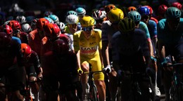 Slovenia's Tadej Pogacar, wearing the overall leader's yellow jersey, rides in the pack during the sixth stage of the Tour de France cycling race over 163.5 kilometers (101.6 miles) with start in Macon and finish in Dijon, France, Thursday, July 4, 2024. (AP Photo/Daniel Cole)
