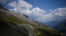 FILE - The pack climbs Col du Galibier pass during the twelfth stage of the Tour de France cycling race over 165.5 kilometers (102.8 miles) with start in Briancon and finish in Alpe d'Huez, France, Thursday, July 14, 2022. (AP Photo/Daniel Cole, File)