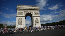 The pack rides in front of the Arc de Triomphe during the last stage of the Tour de France cycling race with start and finish in Paris, Sunday, July 26, 2026. (AP Photo/Mosa'ab Elshamy)
