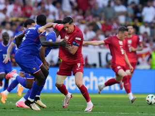 Dayot Upamecano of France, left, defends on Poland's Robert Lewandowski (9) during a Group D match between France and Poland at the Euro 2024 soccer tournament in Dortmund, Germany, Tuesday, June 25, 2024. (AP Photo/Hassan Ammar)

- XEURO2024X