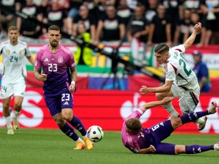 Hungary's Roland Sallai (20) and Germany's Joshua Kimmich (6) battle for the ball during a Group A match between Germany and Hungary at the Euro 2024 soccer tournament in Stuttgart, Germany, Wednesday, June 19, 2024. (AP Photo/Matthias Schrader)

- XEURO2024X
