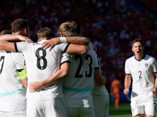 Austria players celebrate after an own goal from Donyell Malen of the Netherlands during a Group D match between Netherlands and Austria at the Euro 2024 soccer tournament in Berlin, Germany, Tuesday, June 25, 2024. (AP Photo/Ebrahim Noroozi)

- XEURO2024X