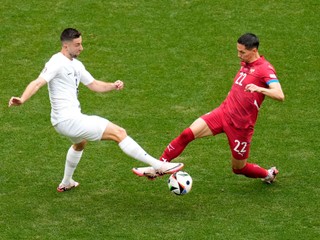 Slovenia's Andraz Sporar vies for the ball with Serbia's Sasa Lukic, right, during a Group C match between Slovenia and Serbia at the Euro 2024 soccer tournament in Munich, Germany, Thursday, June 20, 2024. (AP Photo/Ariel Schalit)

- XEURO2024X