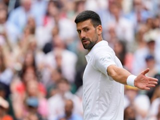 Novak Djokovic of Serbia reacts during his match against Carlos Alcaraz of Spain in the men's singles final at the Wimbledon tennis championships in London, Sunday, July 14, 2024. (AP Photo/Kirsty Wigglesworth)