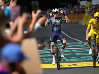 Denmark's Jonas Vingegaard celebrates as he crosses the finish line ahead of Slovenia's Tadej Pogacar, wearing the overall leader's yellow jersey, to win the eleventh stage of the Tour de France cycling race over 211 kilometers (131.1 miles) with start in Evaux-les-Bains and finish in Le Lorian, France, Wednesday, July 10, 2024. (AP Photo/Jerome Delay)