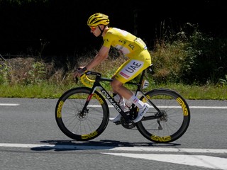 Slovenia's Tadej Pogacar, wearing the overall leader's yellow jersey, rides during the fifteenth stage of the Tour de France cycling race over 198 kilometers (123 miles) with start in Loudenvielle and finish on Plateau de Beille, France, , Sunday, July 14, 2024. (AP Photo/Jerome Delay)