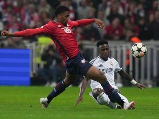 Real Madrid's Vinicius Junior, bottom, and Lille's Alexsandro Ribeiro vie for the ball during the Champions League opening phase soccer match between Lille and Real Madrid at the Stade Pierre Mauroy in Villeneuve-d'Ascq, outside Lille, France, Wednesday, Oct. 2, 2024. (AP Photo/Thibault Camus)

- XCHAMPIONSLEAGUEX