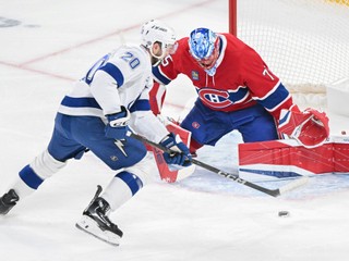 Tampa Bay Lightning's Nick Paul (20) moves in to score against Montreal Canadiens goaltender Jakub Dobes, right, during first-period NHL hockey game action in Montreal, Sunday, Feb. 9, 2025. (Graham Hughes/The Canadian Press via AP)

- NHL;Hockey;game;season;league;teams;players;athletes;skate;puck;ice