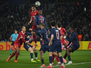 Liverpool's Luis Diaz, left, and PSG's Nuno Mendes jump for the ball during the Champions League round of 16 first leg soccer match betwen Paris Saint-Germain and Liverpool in Paris, France, Wednesday, March 5, 2025. (AP Photo/Christophe Ena)

- XCHAMPIONSLEAGUEX