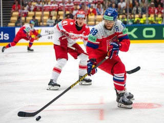 Czechia's David Pastrnak, right, in action with Denmark's Jesper Jensen Aabo during the group B match between Czechia and Denmark at the IIHF Ice Hockey World Championships in Herning, Denmark, Monday May 12, 2025. (Bo Amstrup/Ritzau Scanpix via AP)