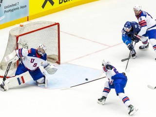 USA's goaltender Jeremy Swayman, left, USA's defender Zeev Buium, foreground look on as Kazakhstan's forward Kirill Panyukov , second right and USA's defender Zach Werenski vie for the puck, during the IIHF 2025 World Championship preliminary round group B game between Kazakhstan and USA, at the Jyske Bank Boxen, in Herning, Denmark, Sunday, May 18, 2025. (Salvatore Di Nolfi/Keystone via AP)