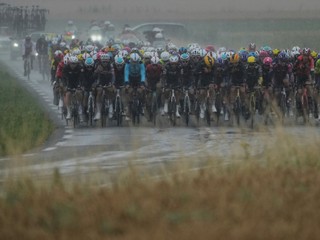 The pack rides during the second stage of the Tour de France cycling race over 209.1 kilometers (129.9 miles) with start in Lauwin-Planque and finish in Boulogne-sur-Mer, France, Sunday, July 6, 2025. (AP Photo/Thibault Camus)