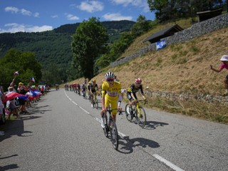 Slovenia's Tadej Pogacar, wearing the overall leader's yellow jersey, is followed by Denmark's Jonas Vingegaard as they climb Col de la Madeleine during the eighteenth stage of the Tour de France cycling race over 171.5 kilometers (106.6 miles) with start in Vif and finish in Courchevel Col de la Loze, France, Thursday, July 24, 2025. (AP Photo/Thibault Camus)