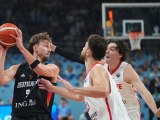 Germany's Franz Wagner, left, drives to the basket asÂ Turkey's Alperen Sengun, front, and Turkey's Cedi Osman block him during the Eurobasket, European Basketball Championship final match between Turkey and Germany at the Riga Arena in Riga, Latvia, Sunday, Sept. 14, 2025. (AP Photo/Sergei Grits)