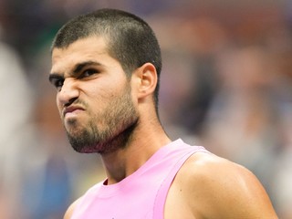 Carlos Alcaraz, of Spain, reacts after a rally against Jannik Sinner, of Italy, during the men's singles final of the U.S. Open tennis championships, Sunday, Sept. 7, 2025, in New York. (AP Photo/Kirsty Wigglesworth)