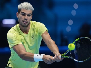 Spain's Carlos Alcaraz returns to Italy's Jannik Sinner during the final tennis match of the ATP World Tour Finals, in Turin, Italy, Sunday, Nov. 16, 2025. (AP Photo/Antonio Calanni)