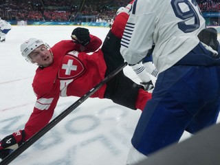 France's Floran Douay, right, checks Switzerland's Dean Kukan during a preliminary round match of men's ice hockey between Switzerland and France at the 2026 Winter Olympics, in Milan, Italy, Thursday, Feb. 12, 2026. (AP Photo/Carolyn Kaster)

- 2026 Winter Olympic Games;Winter Olympic games;Olympic games;Sports;Events;XXV Olympiad;Olympics 2026;Milan Cortina Olympics;Winter Olympics 2026;Milan Cortina Winter Olympics;2026 Milan Cortina Olympic Games;Olympics;Winter Games