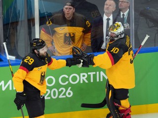 Germany's Leon Draisaitl (29) is congratulated by goalkeeper Philipp Grubauer (30) after Draisaitl scored a goal against France during the first period of a men's ice hockey qualification playoff game at the 2026 Winter Olympics, in Milan, Italy, Tuesday, Feb. 17, 2026. (AP Photo/Carolyn Kaster)

- 2026 Milan Cortina Olympic Games;2026 Winter Olympic Games;Events;Milan Cortina Olympics;Milan Cortina Winter Olympics;Olympic games;Olympics;Olympics 2026;Sports;Winter Games;Winter Olympic games;Winter Olympics 2026;XXV Olympiad