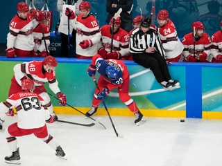 Linesperson Jake Davis (91) gets out of the way as Czechia's Lukas Sedlak (23) battles for the puck with Denmark's Nicholas Jensen (48) and Patrick Russell (63) during the first period of a men's ice hockey qualification playoff game at the 2026 Winter Olympics, in Milan, Italy, Tuesday, Feb. 17, 2026. (AP Photo/Hassan Ammar)

- 2026 Milan Cortina Olympic Games;2026 Winter Olympic Games;Events;Milan Cortina Olympics;Milan Cortina Winter Olympics;Olympic games;Olympics;Olympics 2026;Sports;Winter Games;Winter Olympic games;Winter Olympics 2026;XXV Olympiad