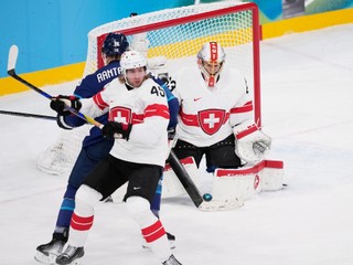 Switzerland's Leonardo Genoni (63) deflects the puck during a men's ice hockey quarterfinal game between Finland and Switzerland at the 2026 Winter Olympics, in Milan, Italy, Wednesday, Feb. 18, 2026. (AP Photo/Petr David Josek)
- 2026 Winter Olympic Games;Winter Olympic games;Olympic games;Sports;Events;XXV Olympiad;Olympics 2026;Milan Cortina Olympics;Winter Olympics 2026;Milan Cortina Winter Olympics;2026 Milan Cortina Olympic Games;Olympics;Winter Games