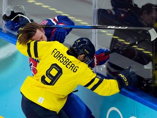 United States' Jake Sanderson (85) loses his helmet as he battles with Sweden's Filip Forsberg (9) during the first period of a men's ice hockey quarterfinal game at the 2026 Winter Olympics, in Milan, Italy, Wednesday, Feb. 18, 2026. (AP Photo/Hassan Ammar)

- 2026 Milan Cortina Olympic Games;2026 Winter Olympic Games;Events;Milan Cortina Olympics;Milan Cortina Winter Olympics;Olympic games;Olympics;Olympics 2026;Sports;Winter Games;Winter Olympic games;Winter Olympics 2026;XXV Olympiad