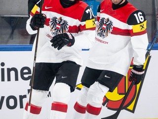 Austria's Benjamin Nissner, left, celebrates after his goal, during the 2026 IIHF Men's Ice Hockey World Championship preliminary round group A game between Britain and Austria, in Zurich, Switzerland, Saturday, May 16, 2026. (Andreas Becker/Keystone via AP)